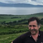 Smiling man with countryside as a back drop