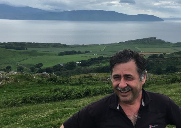 Smiling man with countryside as a back drop