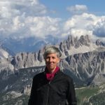 Standing woman with mountain backdrop