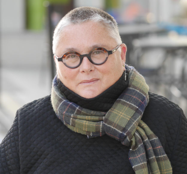 Bespectacled woman wearing a scarf