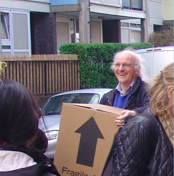Nick Tyler carrying a cardboard box
